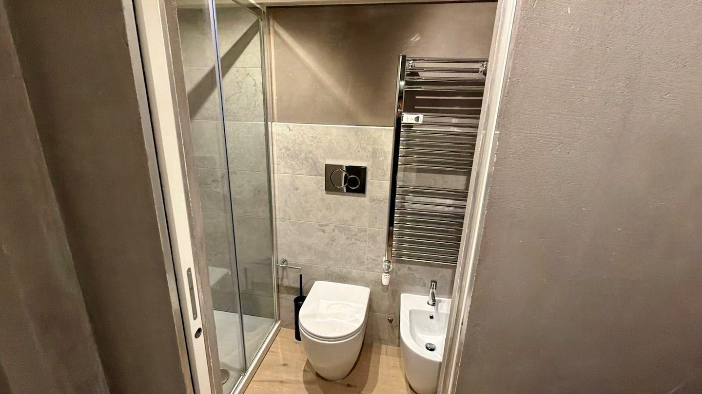 Bathroom with shower, toilet and bidet