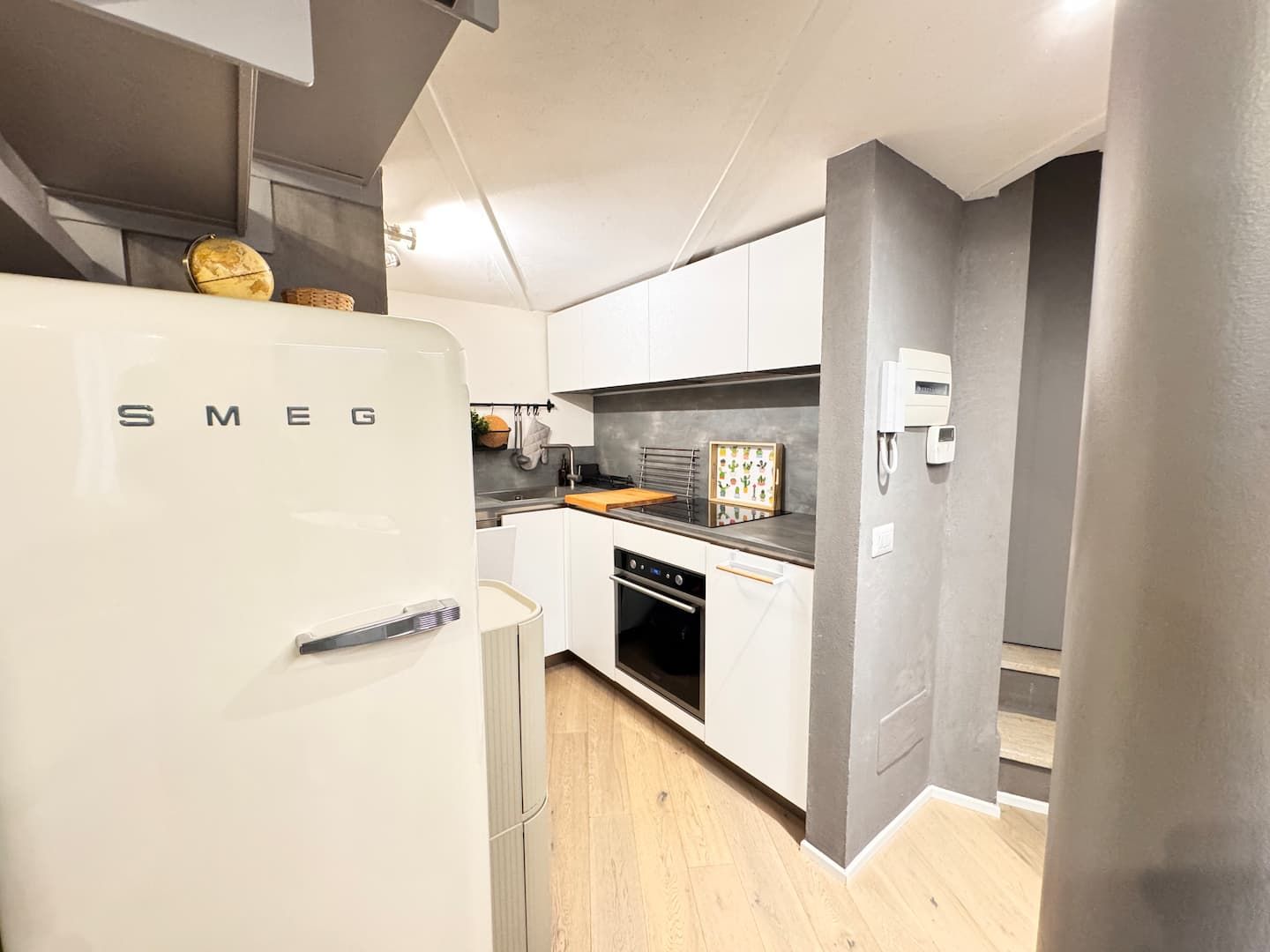 Fitted kitchen with oven and fridge