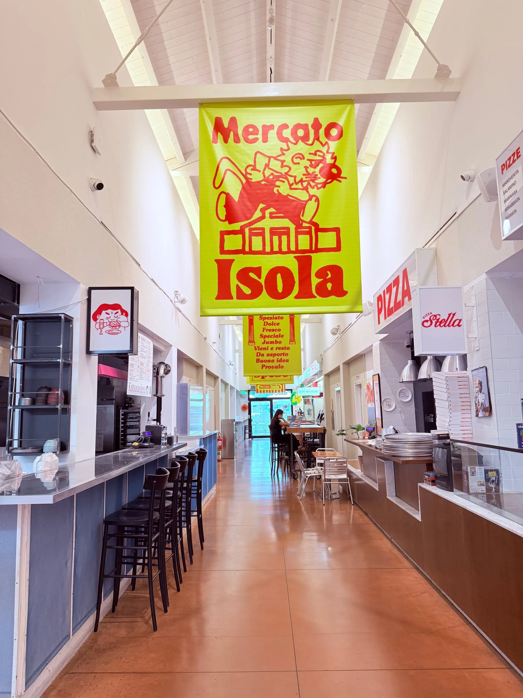 Inside the covered municipal market in piazzale Lagosta, with the long-standing stalls