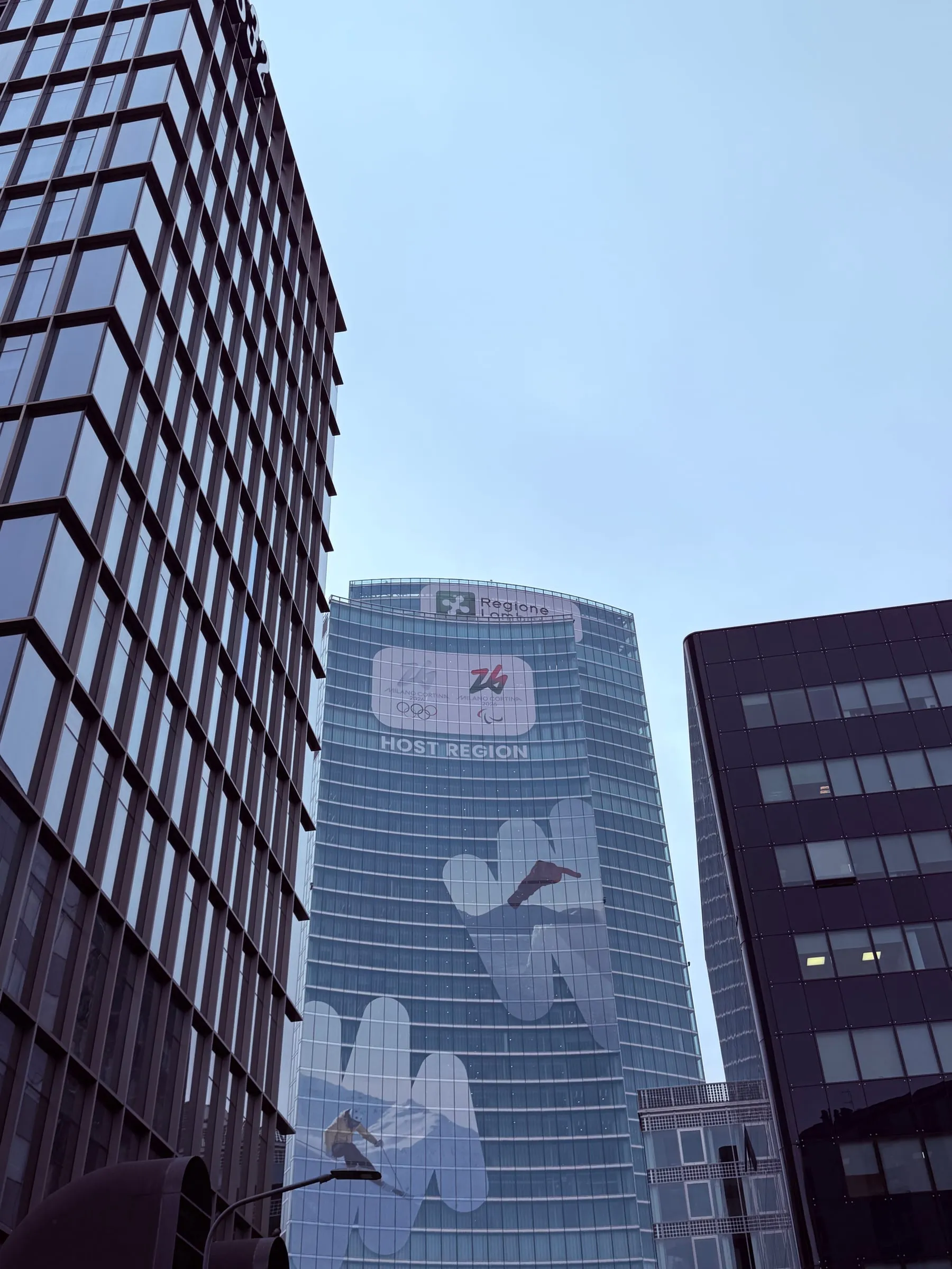 Palazzo Lombardia seen from the street, with the tower rising above the lower part of the building