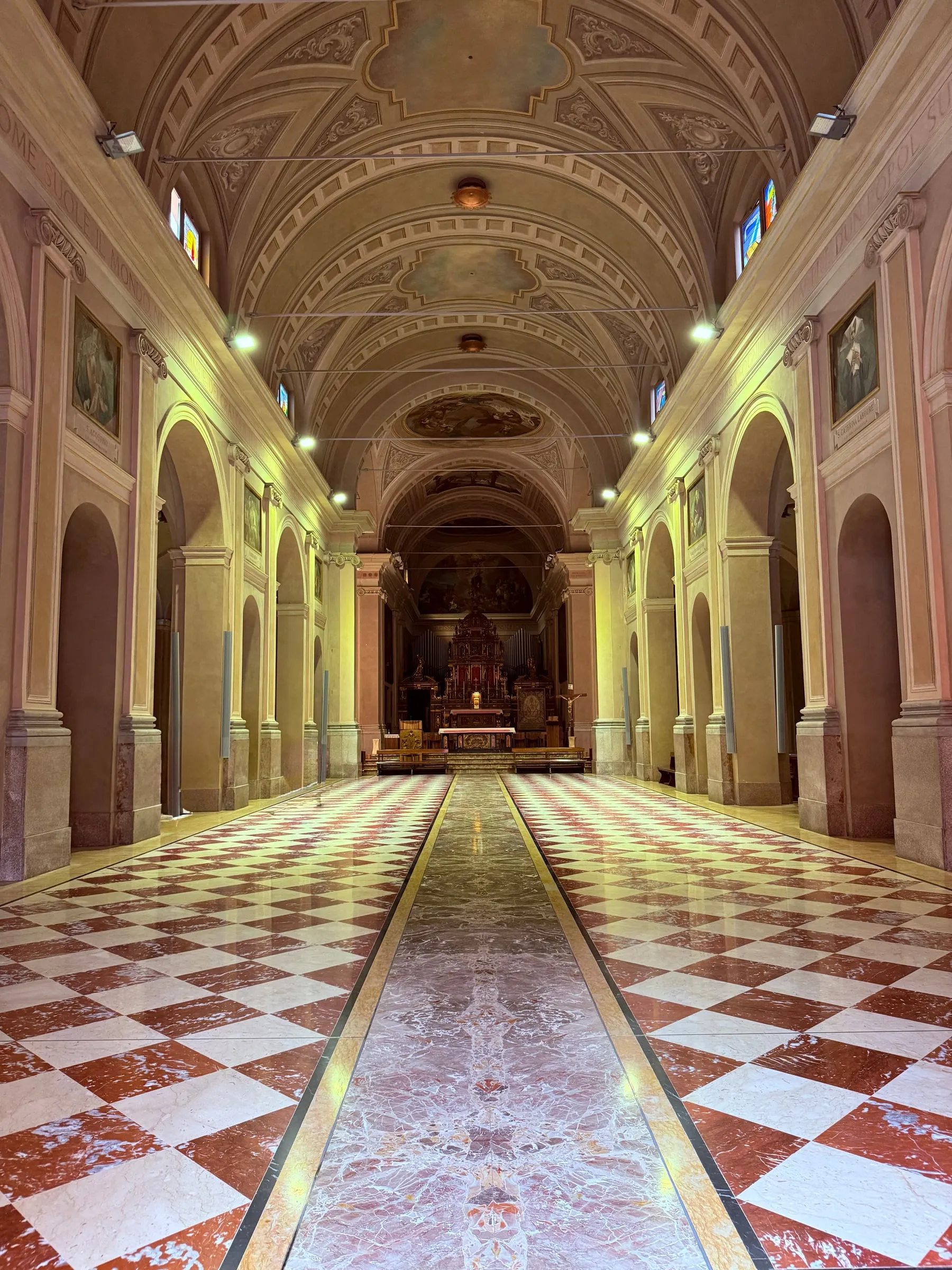 The nave of the church of Santa Maria alla Fontana, with the checkerboard floor and the altar at the far end