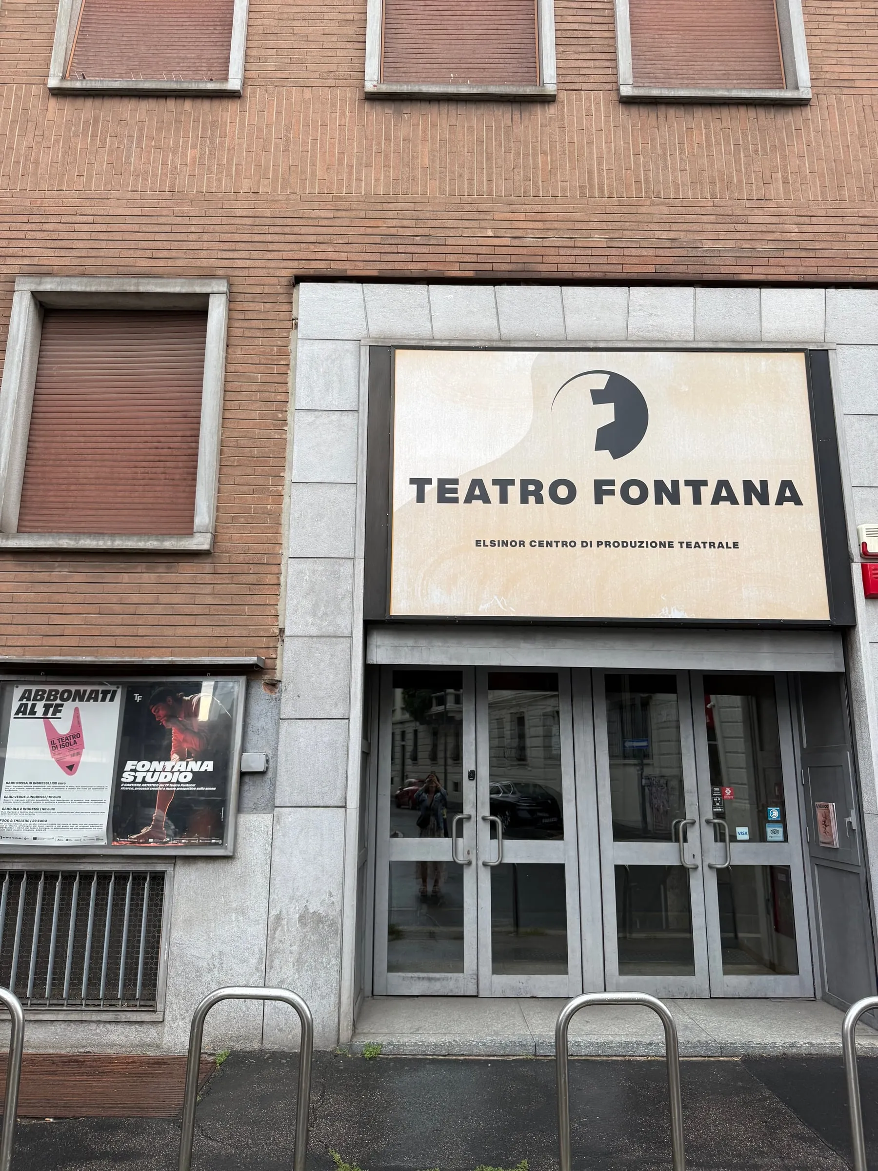 The entrance to the Teatro Fontana on via Boltraffio, with the sign above the glass doors